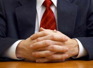 Picture of businessman's clasped hands