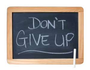Chalk board with Don't give up written on it